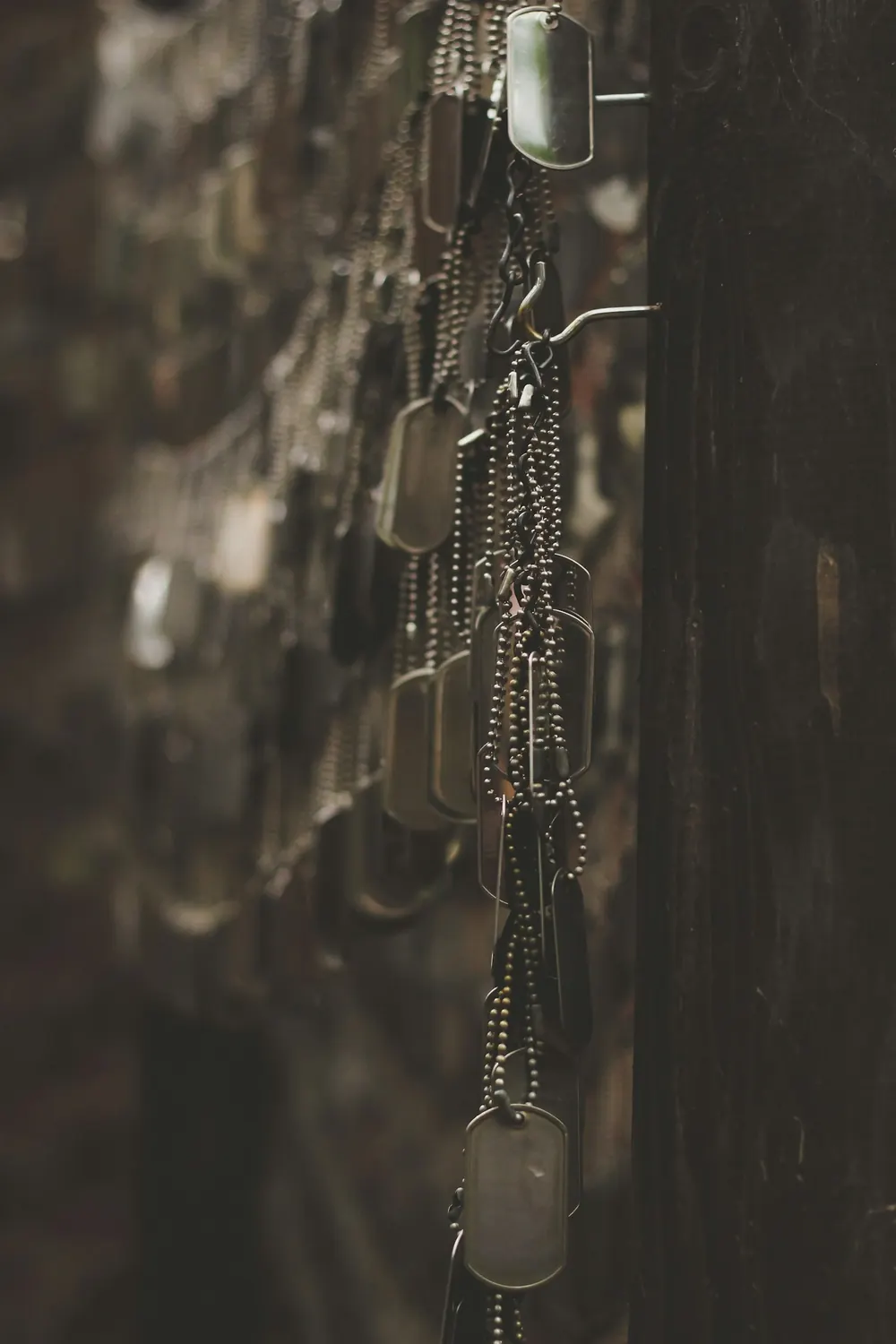 Military dog tags hanging from a chain